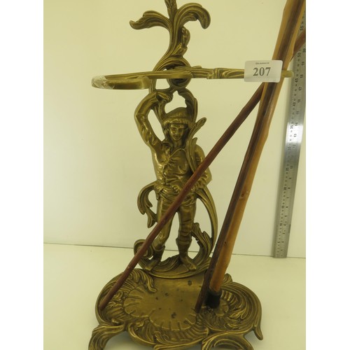 207 - ORNATE BRASS WALKING STICK STAND AND THREE WALKING STICKS/CANES