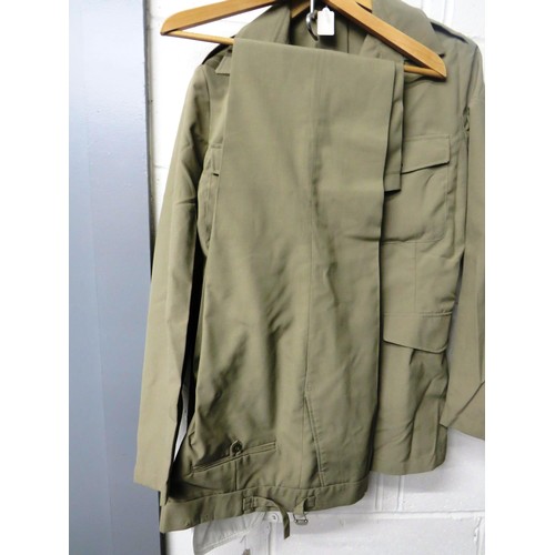 212 - MILITARY CLOTHING, TWO SHIRTS AND A PAIR OF TROUSERS