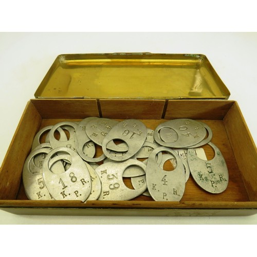 217 - BRASS INLAID TIN WITH THEATRE TAGS