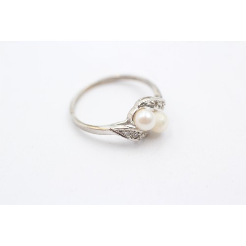 408 - 9ct white gold two pearl and diamond set ring (1.5g)