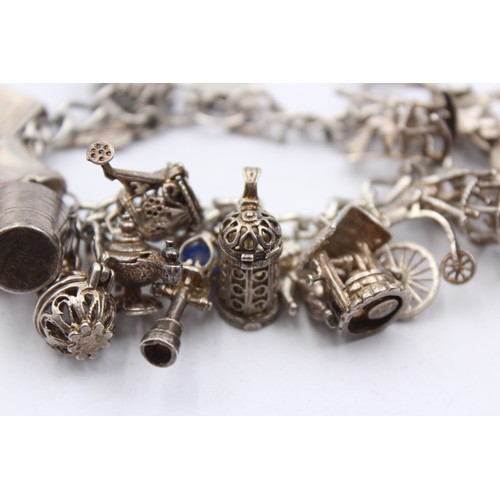 410 - .925 Charm Bracelet With Assorted Charms (93g)