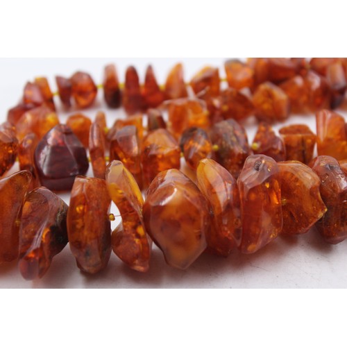 430 - A Large Amber Nugget Necklace (197g)