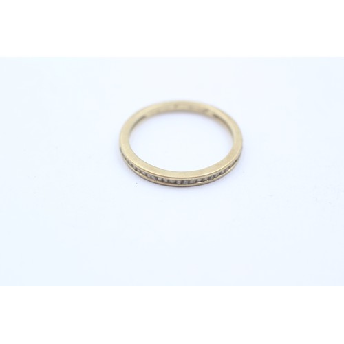 436 - 9ct gold diamond baguette cut half eternity ring (1g) SIZE- J