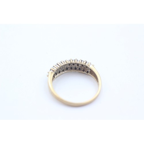 460 - 9ct yellow and white gold diamond and sapphire three row half eternity ring (2.6g) SIZE- P