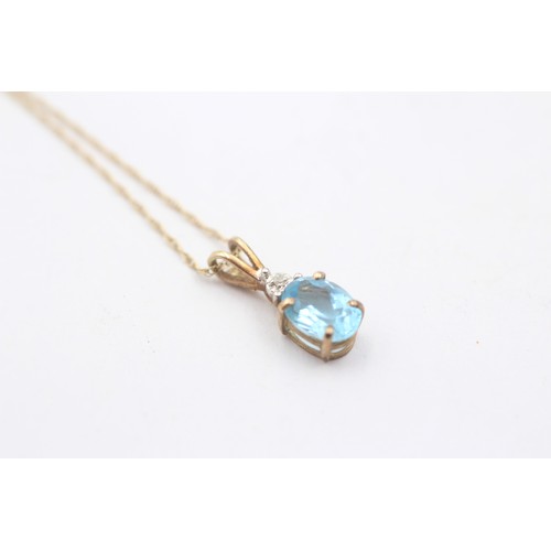 468 - 9ct gold diamond and oval topaz pendant necklace (1g)