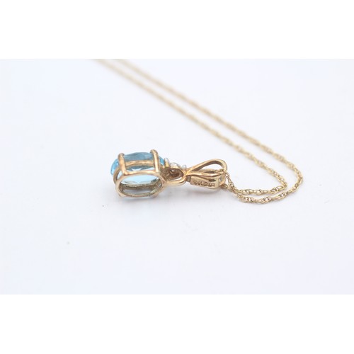 468 - 9ct gold diamond and oval topaz pendant necklace (1g)