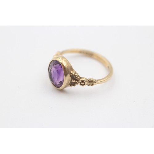 484 - 9ct gold oval amethyst ornate shoulders solitaire ring (2.9g) SIZE- N