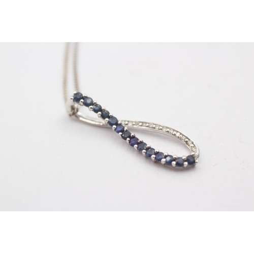 492 - 9ct white gold diamond and sapphire peaved loop pendant necklace (2.3g)