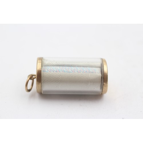 496 - 9ct gold one pound cylinder case charm pendant (3.3g)