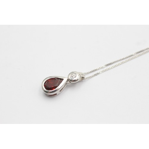 500 - 9ct white gold diamond and garnet teardrop pendant necklace (2.2g)