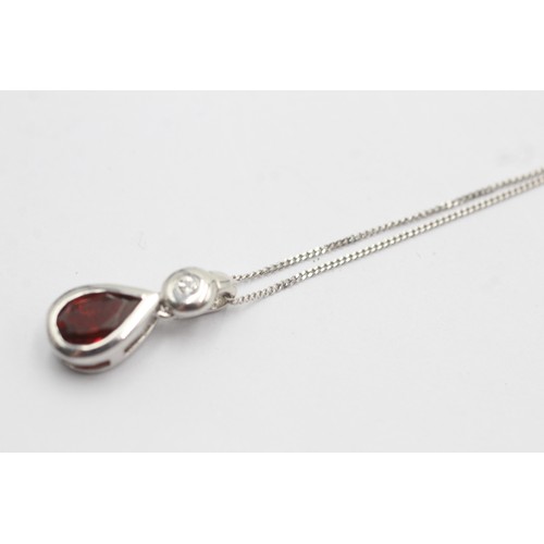 500 - 9ct white gold diamond and garnet teardrop pendant necklace (2.2g)