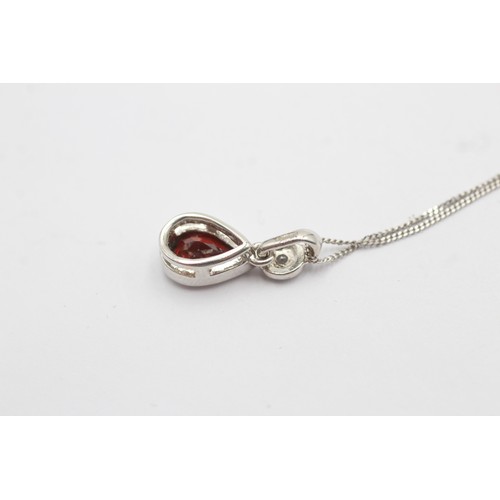 500 - 9ct white gold diamond and garnet teardrop pendant necklace (2.2g)