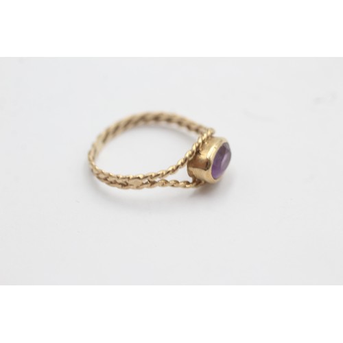 520 - 9ct gold twisted rope band oval amethyst solitaire ring (1.5g) SIZE- N