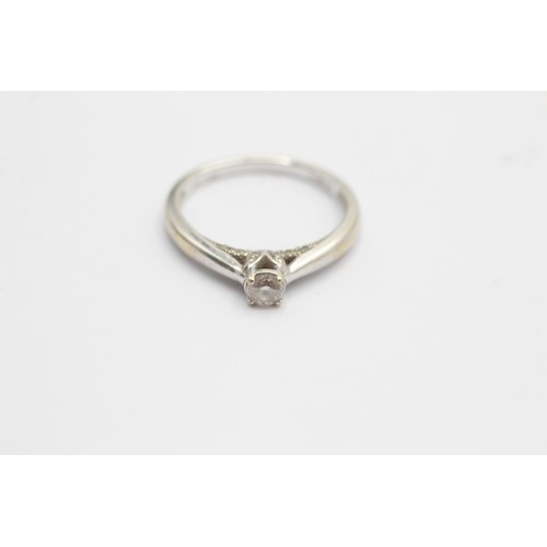 604 - 9ct white gold diamond solitaire and facet set ring (2.2g) SIZE- M