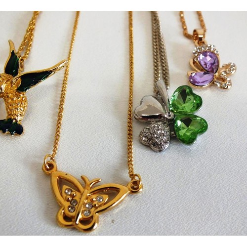 287 - 5 GOLDTONE AND SILVERTONE NECKLACES, BUTTERFLIES AND HUMMING BIRD