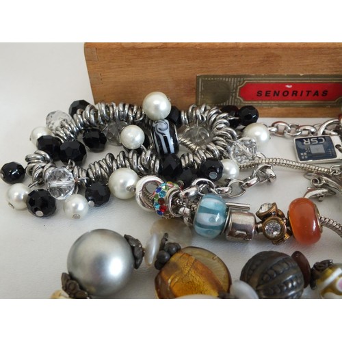 46 - BOX OF ASSORTED JEWELLERY & CHARM BRACELETS SOME SILVER