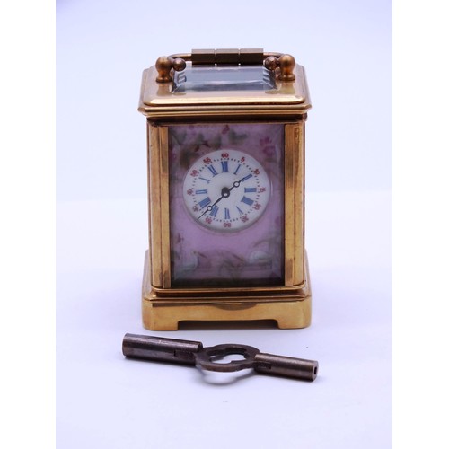 24 - MINIATURE 8 DAY BRASS CARRIAGE CLOCK WITH ENAMEL DECORATION WORKING WITH KEY, APPROX HEIGHT 8cm