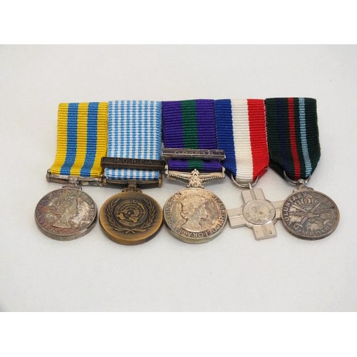 46 - SET OF FIVE MILITARY MOUNTED MINIATURE MEDALS INCLUDES VOLUNTARY SERVICE MEDAL, KOREA MEDAL etc