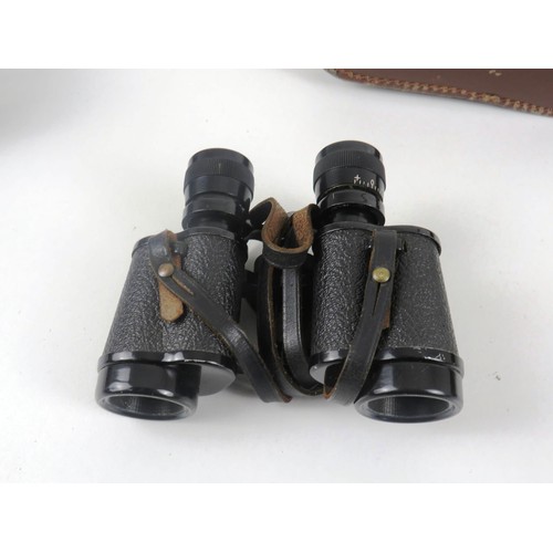 11 - TWO SETS OF BINOCULARS WIRH LEATHER CARRY CASES