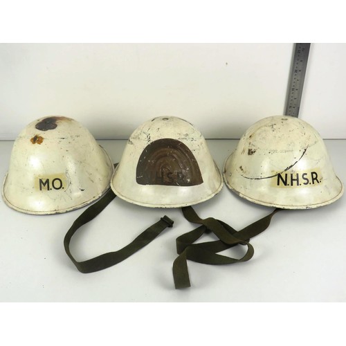 20 - THREE METAL HELMETS, 2 x NATIONAL HOSPITAL SERVICE RESERVES- ONE IMPRESSED MARK INSIDE READS RO&CO S... 