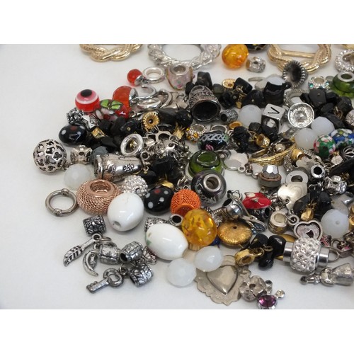 102 - THREE STAINLESS STEEL CHUNKY IDENTITY BRACELETS, BOX OF MIXED CHARMS & SCARF RINGS