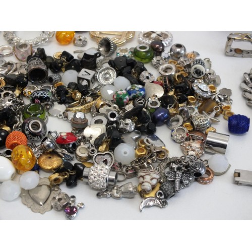 102 - THREE STAINLESS STEEL CHUNKY IDENTITY BRACELETS, BOX OF MIXED CHARMS & SCARF RINGS