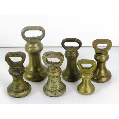 59 - SET OF SIX BRASS BELL WEIGHTS AND DARK GREEN CAST IRON No 50 SALTER SCALES