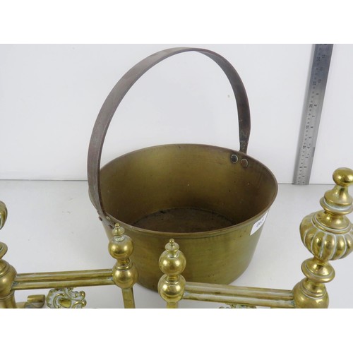 65 - LARGE BRASS JAM PAN WITH CAST IRON HANDLE, BRASS TRIVET, BRASS FIRE DOGS AND FIRESIDE TOOLS