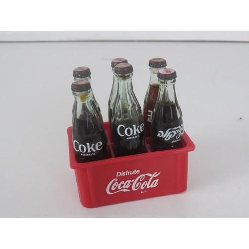 141 - SELECTION OF COCA COLA ITEMS