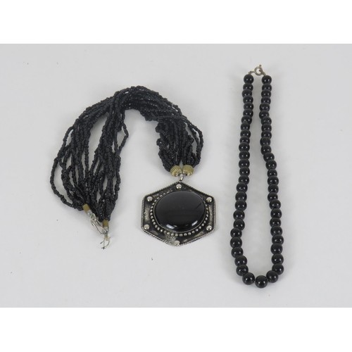 319 - TWO BLACK GLASS BEADED NECKLACES