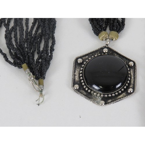 319 - TWO BLACK GLASS BEADED NECKLACES