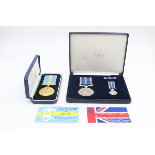 517 - 2 x Boxed Medals Inc National Service to Pte Rowlinson & Hong Kong Service Medal