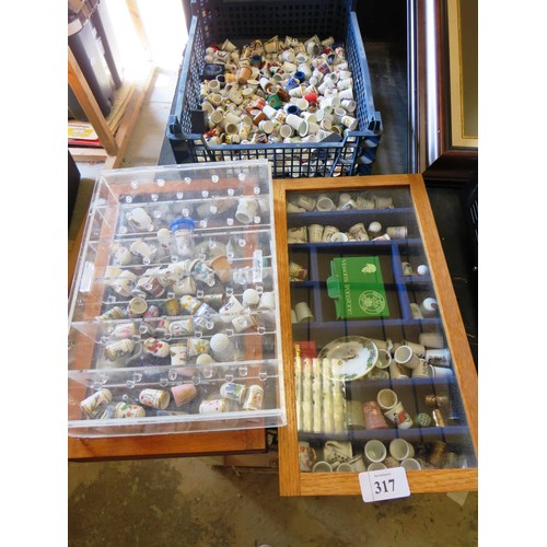 317 - JOBLOT OF THIMBLES, MINIATURE CUP AND SAUCERS, TWO WOOD AND GLASS DISPLAY CABINETS AND PERSPEX DISPL... 