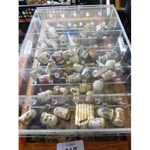 317 - JOBLOT OF THIMBLES, MINIATURE CUP AND SAUCERS, TWO WOOD AND GLASS DISPLAY CABINETS AND PERSPEX DISPL... 