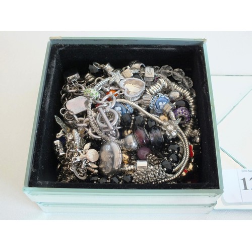 121 - MIRRORED JEWELLERY BOX FILLED WITH ASSORTED CHARM BRACELETS
