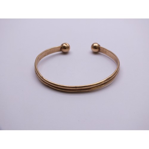 285 - 9ct GOLD TORQUE BANGLE 4.4g