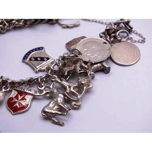 88 - STERLING SILVER CHARM BRACELET WITH 30 SILVER CHARMS - weight 68g