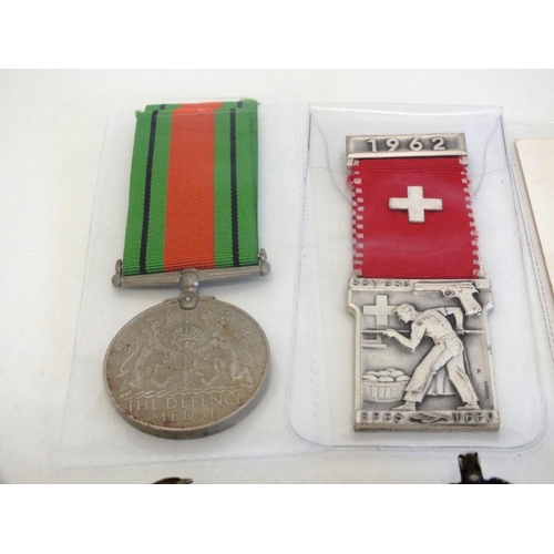 76 - WWII DEFENCE MEDAL AND SILVER AIR RAID BADGE