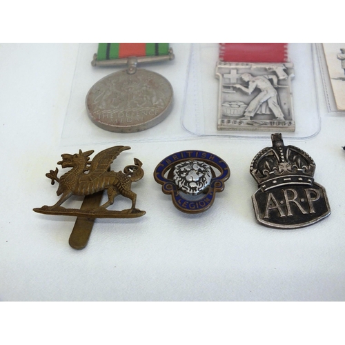 76 - WWII DEFENCE MEDAL AND SILVER AIR RAID BADGE