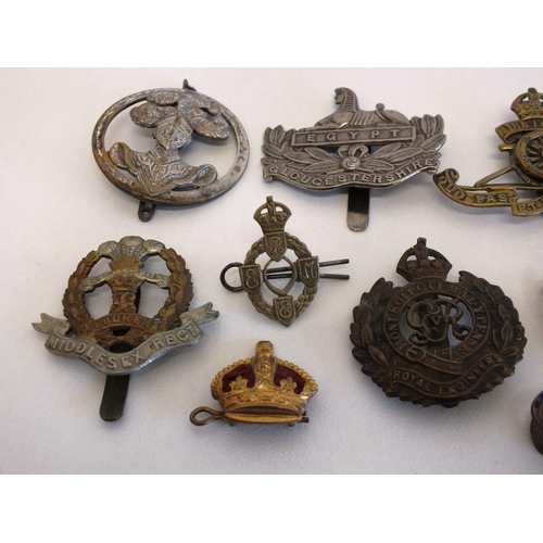 79 - 10 x MILITARY BADGES INCLUDING CAP BADGES