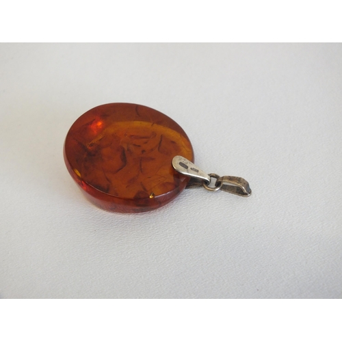 144 - AMBER PENDANT WITH 875 (21CT) GOLD HALLMARKED BAIL