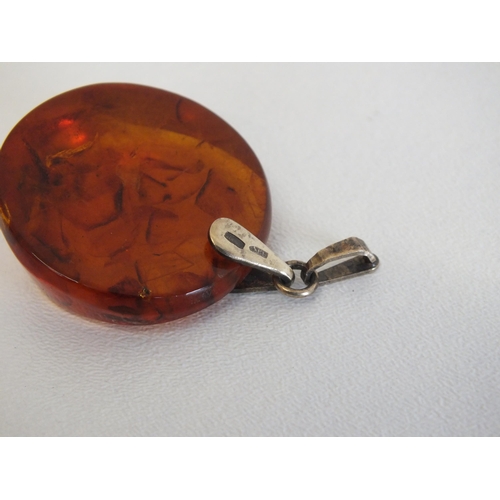 144 - AMBER PENDANT WITH 875 (21CT) GOLD HALLMARKED BAIL