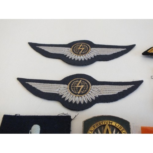 69 - 15 x VARIOUS MILITARY BRASS AND CLOTH BADGES