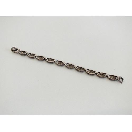 132 - SILVER AND MARCASITE TENNIS BRACELET