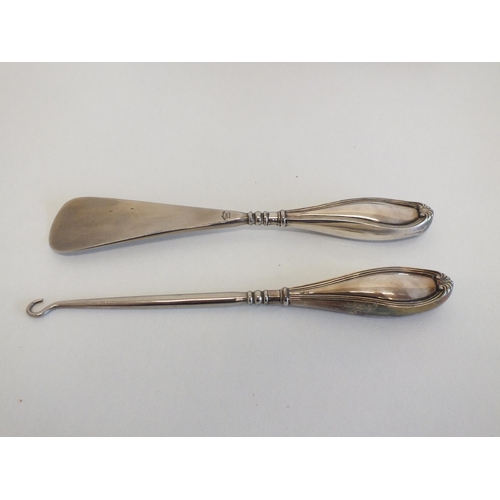 60 - CASED SILVER HANDLED BUTTON HOOK AND SHOE HORN SET