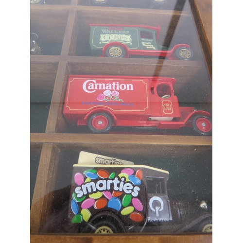 188 - WOOD AND GLASS DISPLAY CASE WITH 15 LLEDO DIECAST ADVERTISING VANS