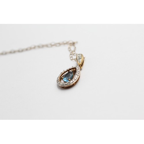 442 - 9ct gold topaz & diamond halo teardrop pendant necklace (1.5g)