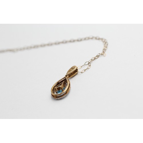 442 - 9ct gold topaz & diamond halo teardrop pendant necklace (1.5g)