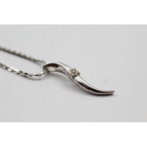 470 - 9ct white gold diamond twist pendant on chain (3.3g)