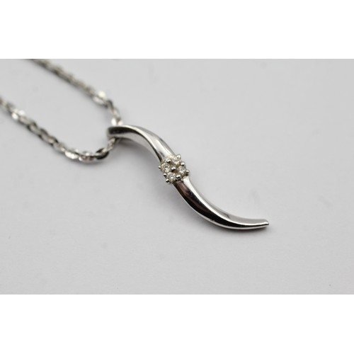 470 - 9ct white gold diamond twist pendant on chain (3.3g)